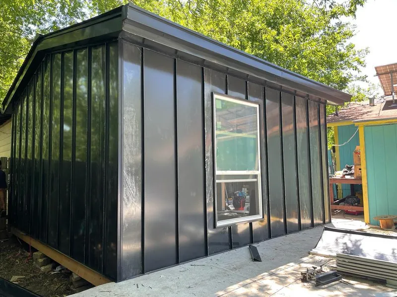 Black standing seam metal wall panels for Roof Inspection in Wollochet